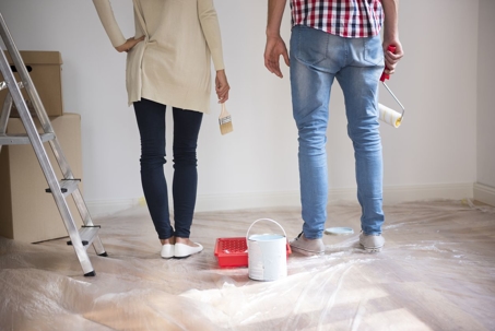 New homeowners painting home walls