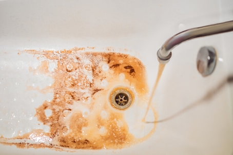 dirty tap water in bathtub