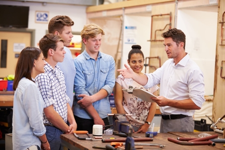 instructor teaching young people about a career in the trades