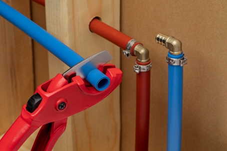 PEX piping being cut