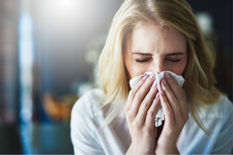 woman sneezing