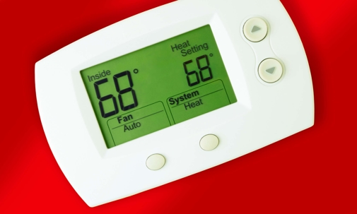 thermostat on red background